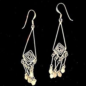 Silver earrings.